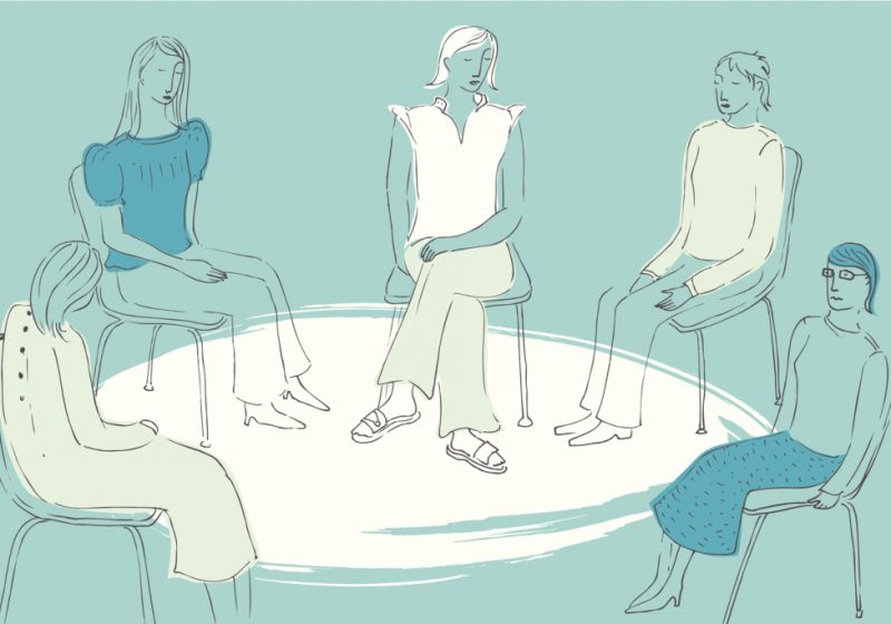 Women sitting together in a circle in support group